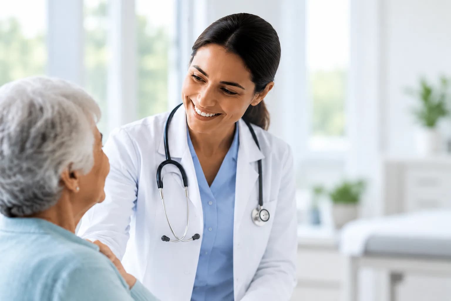 Doctor smiling warmly while checking in with an elderly patient